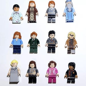 May include: A collection of twelve minifigures from the Harry Potter universe. The figures are all in different poses and wearing various outfits, including robes, sweaters, and uniforms. The figures are made of plastic and are approximately 2 inches tall.