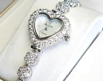 ハート型ケース、マザーオブパール文字盤、グレードAAラウンドブリリアントカット模造ダイヤモンドレディースジュエリーウォッチ
