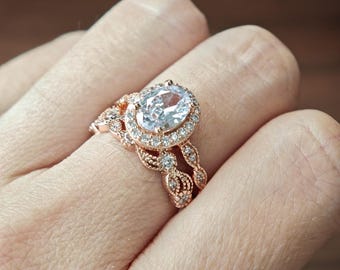 Anillo nupcial Art Déco de inspiración vintage con halo de diamantes simulados de corte ovalado y hojas y enredaderas. Plata de ley 925 maciza. Chapado en oro rosa.