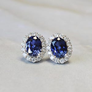 1 Carat Oval Cut Imitation Blue Sapphire Halo Studs Earrings with Round Brilliant-cut Simulated Diamonds 925 Silver 18K White Gold