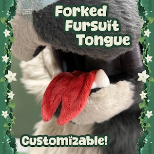 May include: A close-up of a forked fursuit tongue with a red, textured appearance. The tongue is surrounded by grey and white fur. The text "Forked Fursuit Tongue" and "Customizable!" are displayed on the image.