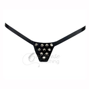 May include: Black thong with silver studs. The triangular front panel is decorated with multiple studs. The straps extend from the sides of the panel. The background is plain white.