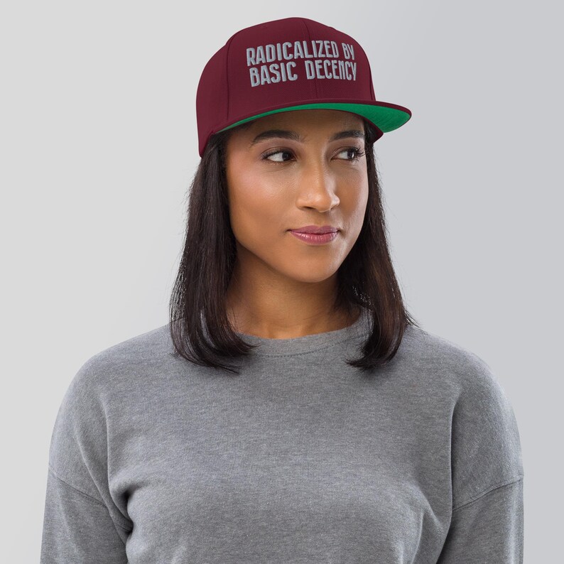 Radicalized by Basic Decency snapback hat for progressives, embroidered political flat brim cap for voters, gift for activists and students Maroon