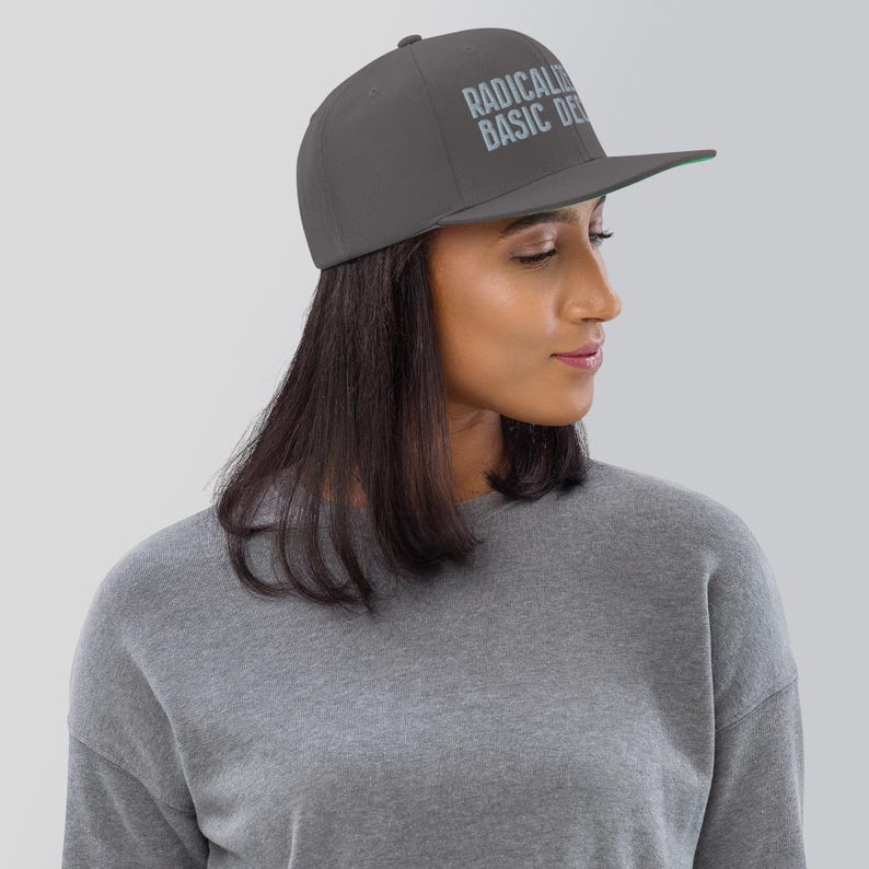 Radicalized by Basic Decency snapback hat for progressives, embroidered political flat brim cap for voters, gift for activists and students Dark Grey