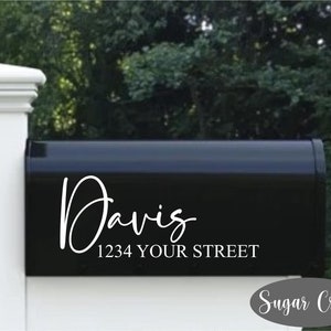 May include: Black mailbox with white vinyl lettering that reads "Davis 1234 Your Street".