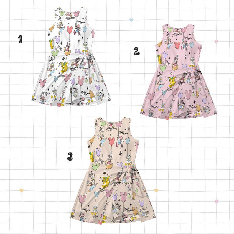 May include: Three sleeveless dresses with a wrap-style design. Each dress features a repeating pattern of cartoon characters, balloons, and stars. The dresses are in white, pink, and beige, with colourful accents. The dresses are suitable for casual wear.
