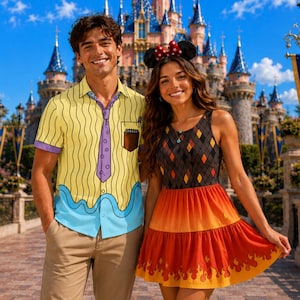 May include: A yellow short-sleeved button-down shirt with a purple tie print and blue wavy hem, paired with tan trousers. Beside it, a sleeveless dress with a black diamond pattern bodice and a tiered orange skirt featuring a flame print hem.