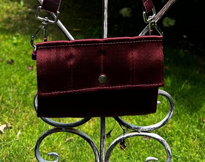 Foldover Crossbody Seatbelt Clutch from FiberTime in Ruby