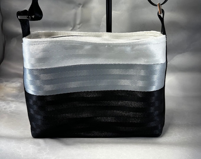 White, Silver and Black Medium Baguette Seat Belt Bag!