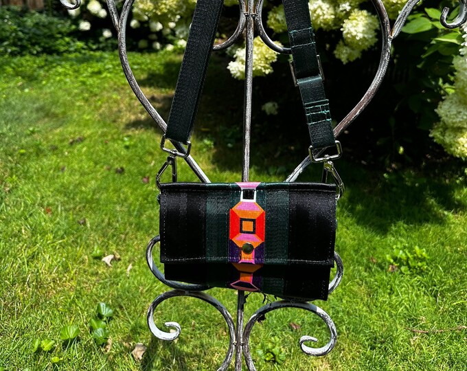 Black, Orange and Buckle Graphic Foldover Crossbody Seatbelt Clutch from FiberTime