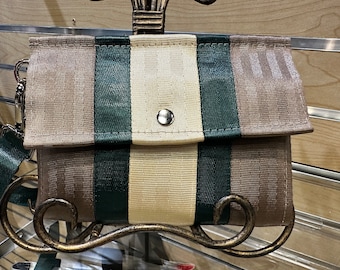 Foldover Crossbody Seatbelt Clutch from FiberTime in Latte, Evergreen and Light Gold