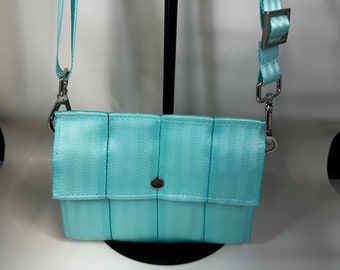 Minty Aqua Foldover Crossbody Seatbelt Clutch from FiberTime