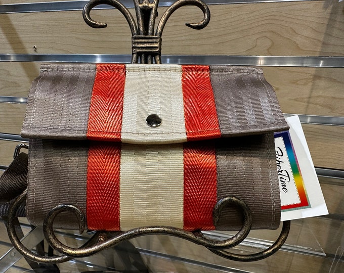 Foldover Crossbody Seatbelt Clutch from FiberTime in Silver in Latte, Orange and Vanilla