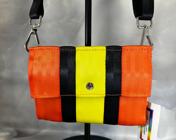 Foldover Crossbody Seatbelt Clutch from FiberTime in Orange, Black and Yellow!