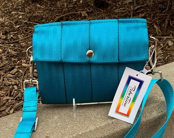 Foldover Crossbody Seatbelt Clutch from FiberTime in Peacock!