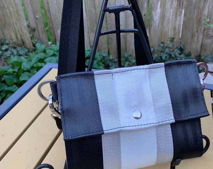 Foldover Crossbody Seatbelt Clutch from FiberTime in Black, Silver and White!