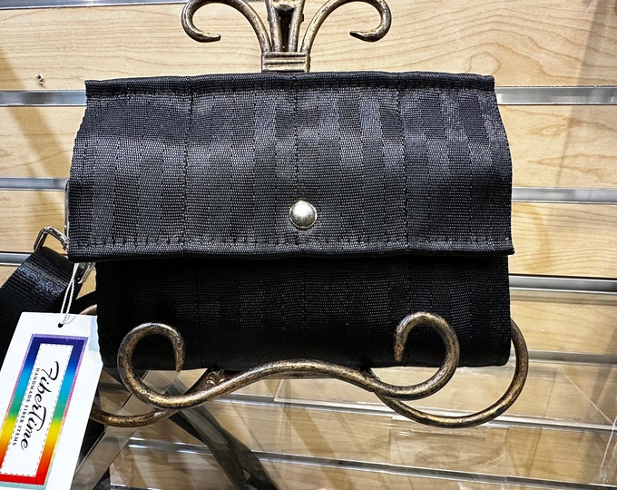 Black Foldover Crossbody Seatbelt Clutch from FiberTime