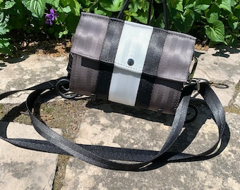 Foldover Crossbody Seatbelt Clutch In Gray, Black and White!