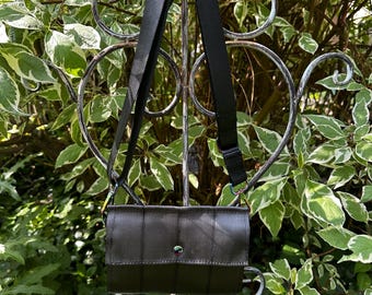 Almost Black Textured Foldover Crossbody Seatbelt Clutch from FiberTime