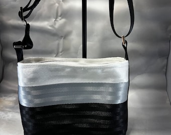 White, Silver and Black Medium Baguette Seat Belt Bag!