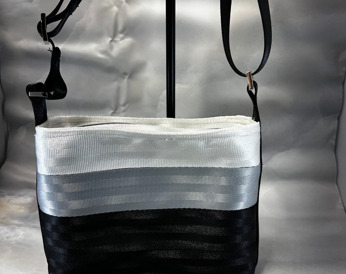 White, Silver and Black Medium Baguette Seat Belt Bag!