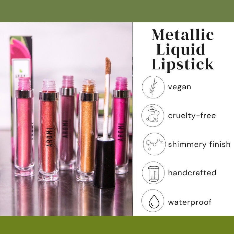 K&ouml;nnte beinhalten: F&uuml;nf Tuben mit metallischem fl&uuml;ssigem Lippenstift in verschiedenen Farbt&ouml;nen von Pink, Gold und Rot. Die Tuben sind mit "AROMI" beschriftet und der Lippenstift wird als vegan, tierversuchsfrei, schimmernd, handgefertigt und wasserfest beschrieben.