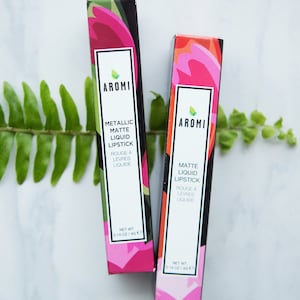 May include: Two tubes of AROMI matte liquid lipstick. One tube is metallic and the other is a regular matte finish. Both tubes have a floral design and are 0.14 oz / 4g.