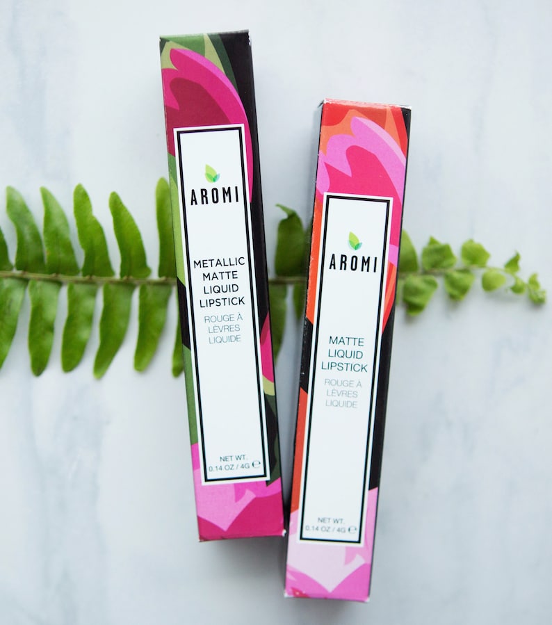 May include: Two tubes of AROMI matte liquid lipstick. One tube is metallic and the other is a regular matte finish. Both tubes have a floral design and are 0.14 oz / 4g.