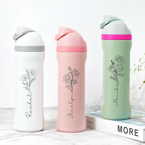 May include: Three insulated water bottles in white, pink, and green. Each bottle features a floral design and a name in a script font. The white bottle has a gray lid, the pink has a pink lid, and the green has a green lid.
