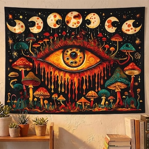 May include: Black tapestry featuring a vibrant, psychedelic design. The artwork includes a large, orange eye with a detailed iris, surrounded by colorful mushrooms and phases of the moon. The color palette is rich with reds, oranges, and blues.