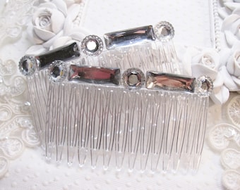 May include: A clear plastic hair comb with silver-toned rhinestones. The comb has a decorative design with multiple rows of teeth.