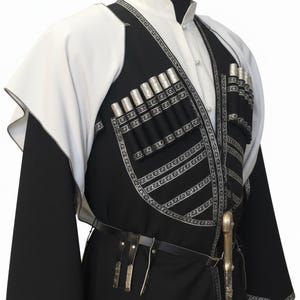 May include: A traditional black and white outfit with silver detailing. The outfit includes a high-collared white shirt, a black vest with silver embellishments, and a black belt. The vest has multiple silver cylindrical decorations. A decorative sword is attached to the belt.