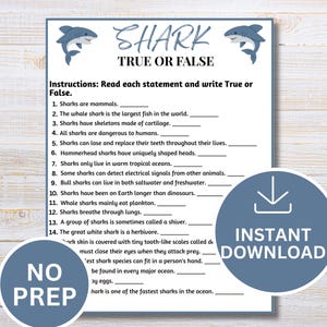 May include: A white paper game sheet titled SHARK TRUE OR FALSE with two blue shark illustrations at the top. The sheet contains fourteen numbered statements about sharks with blank lines for answers, plus additional text at the bottom.