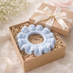 May include: A set of three ceramic mugs with a speckled, matte finish. The mugs are in shades of blue, green, and white. Each mug has a simple, modern design, perfect for coffee or tea. The mugs are stacked on top of each other.