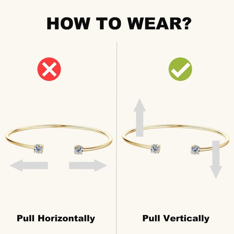 May include: A gold-colored bracelet with a clear gemstone at each end. The image shows how to wear the bracelet, with the text "HOW TO WEAR?" at the top. The text below the bracelet says "Pull Horizontally" and "Pull Vertically".