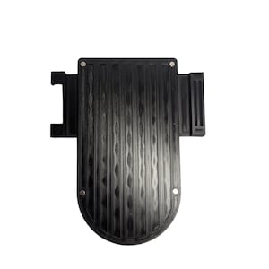 May include: A black plastic automotive component with a ridged surface and a curved base. It features several mounting holes and a rectangular projection on the left. The part is designed for a vehicle.