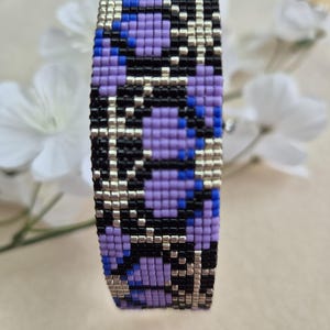 Women&#39;s cuff bracelet in Miyuki delica Violetta beads Handmade on a loom.