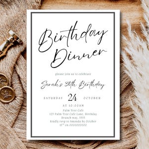 May include: A white invitation with black text that reads "Birthday Dinner" and details for Sarah's 30th birthday. The invitation is framed in black and rests on a textured beige cloth with gold wax seals and a gold pen.