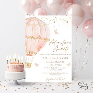 May include: Pink and gold baby shower invitation featuring a hot air balloon illustration. The text reads "Adventure Awaits" and includes the event details: Amelia Adams, Saturday, March 20, 11:00-1:00pm, 123 Pink Baby Shower Lane, Party Way, 5555. RSVP to Amanda by 10th March on 00000000000. Registered at Target.
