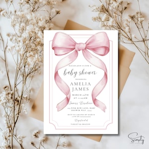 May include: A pink baby shower invitation with a large pink bow and the text "Please join us for a baby shower honoring Amelia James March 20th at 11:00am Jamess Residence Pink Bow Lane, Baby Shower Way, 5555 RSVP to Amanda by March 17th on Registered at Target & Amazon"