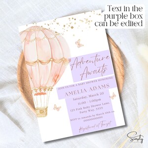 May include: A baby shower invitation featuring a pink and gold hot air balloon illustration. The text reads "Adventure Awaits" and "Amelia Adams". The invitation includes details for the event, including the date, time, location, and RSVP information. The text "Registered at Target" is also included.