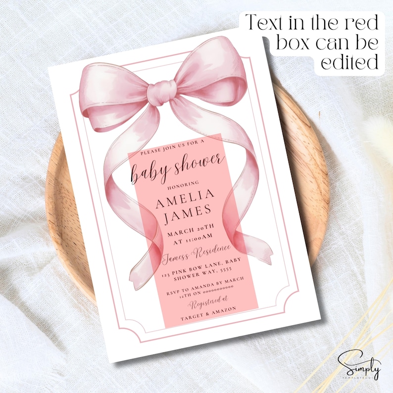 May include: A pink baby shower invitation with a large pink bow and the text "Please join us for a baby shower honoring Amelia James March 20th at 11:00 AM Jamess Residence 123 Pink Bow Lane, Baby Shower Way, 5555 RSVP to Amanda by March 13th on Registered at Target & Amazon"