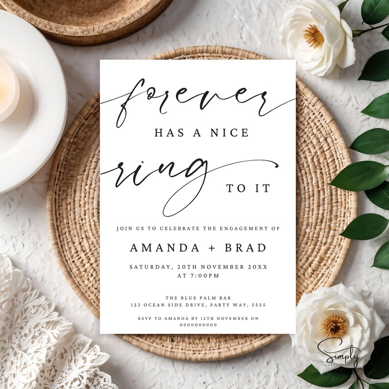 May include: A white card with black calligraphy that reads "forever has a nice ring to it". The card is an engagement announcement for Amanda and Brad, with the date and time of the event, the location, and RSVP information.