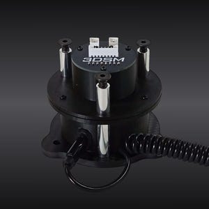 May include: A black cylindrical electronic component featuring the text 3DSM printed on the top surface. It includes a white electrical connector, three vertical silver metal support pillars with screws, and a black coiled cable extending outward.