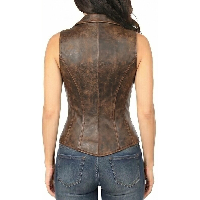 May include: A sleeveless brown leather vest with a collared neckline and a fitted silhouette. The vest has a distressed, textured appearance and is paired with blue denim jeans. The back view showcases the vest's tailored design.