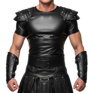 May include: Black leather-like gladiator-style outfit. The ensemble includes a short-sleeved top with studded shoulder pads, a wide belt, a pleated skirt, and matching arm cuffs. The outfit is designed with a focus on detail and texture.