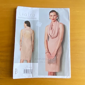 May include: A sewing pattern for a sleeveless dress with a cowl neck and a back cutout. The pattern is for sizes 4-6-8-10-12 and is from the Lialia by Julia Allason collection. The pattern is on a white background with a pink dress on the front and a pink dress on the back.