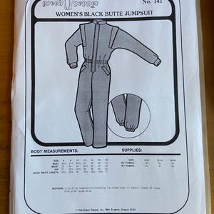 May include: A sewing pattern for a black jumpsuit, with instructions and measurements for sizes 6 to 18. The pattern is from The Green Pepper, Inc. and is for a women's black butte jumpsuit.