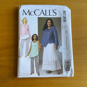 May include: Sewing pattern for a wrap top and skirt. The pattern is for sizes 18W-20W-22W-24W. The pattern is from McCall's and the pattern number is M7368.