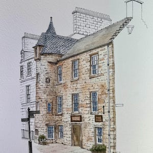 May include: Watercolour painting of a historic stone building with a turret and multiple windows. The building has a grey slate roof. The painting includes a street sign and a planter. The artist's signature is visible.